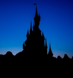 Silhouette of Disney castle at dusk