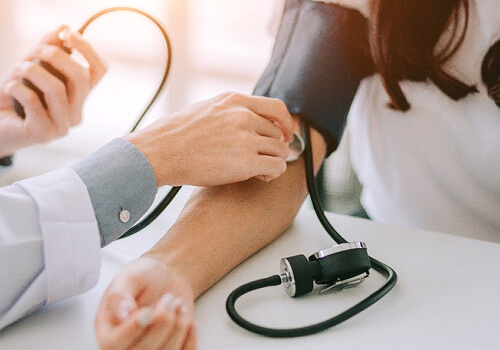 blood pressure being taken for a patient