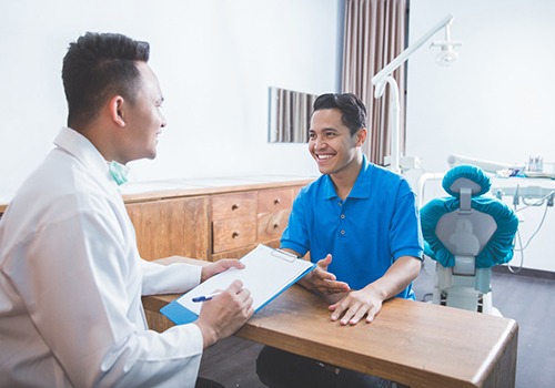 patient talking to dentist 