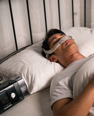 Man wearing a CPAP mask.