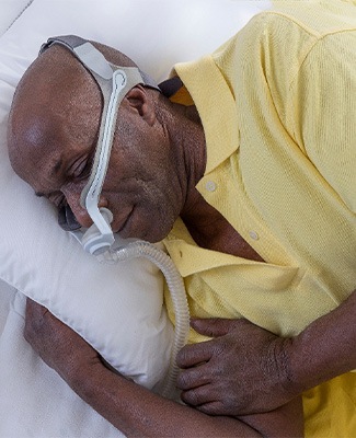 Man with a CPAP mask.