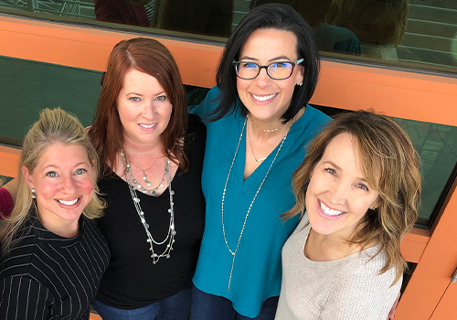 Doctor Layman smiling with three team members at Go To Sleep Center Glendale