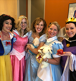 Doctor Layman and team members dressed as Disney princesses