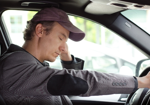 Man falling asleep while driving